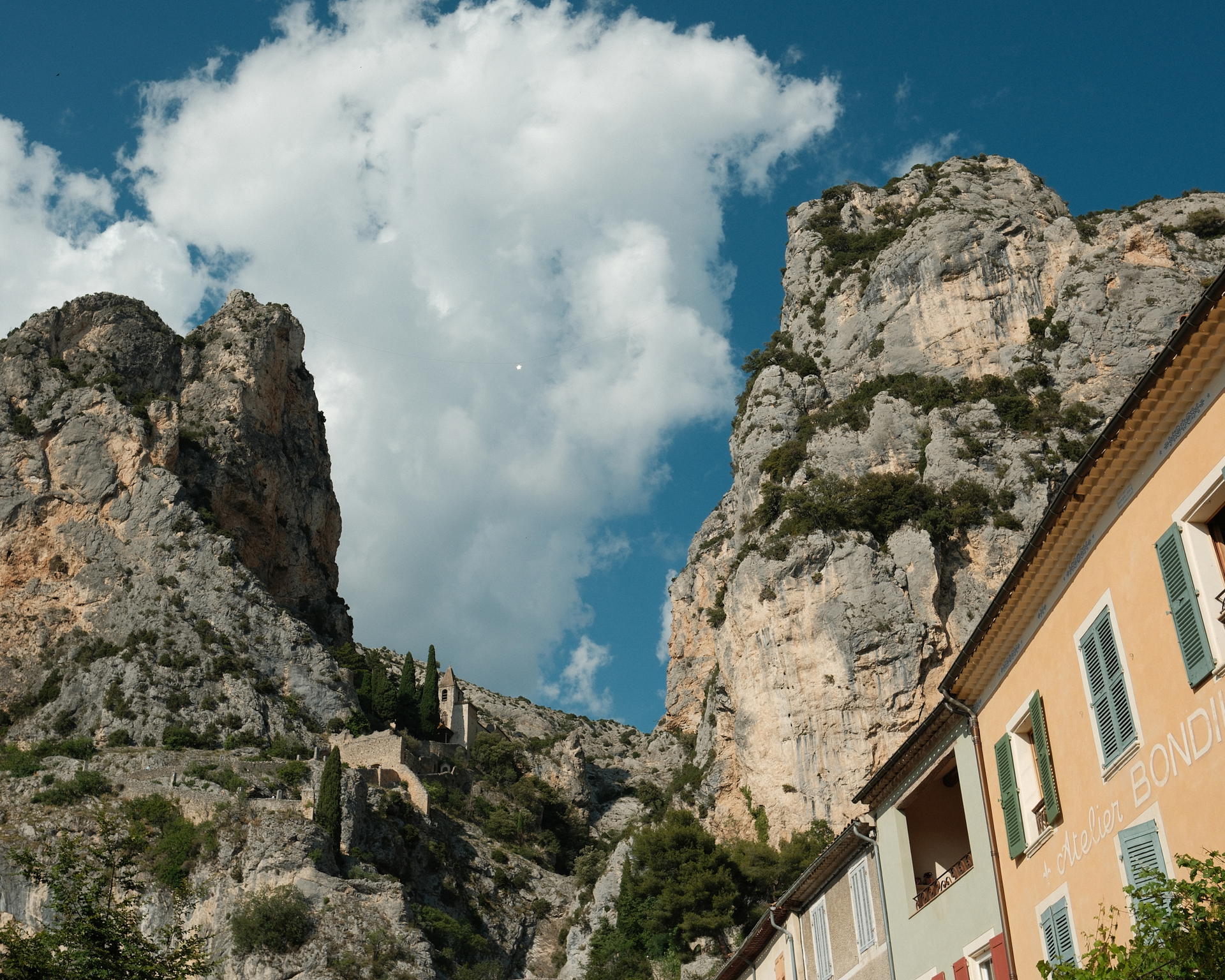 View of the mountains and church at Moustiers-Sainte-Marie