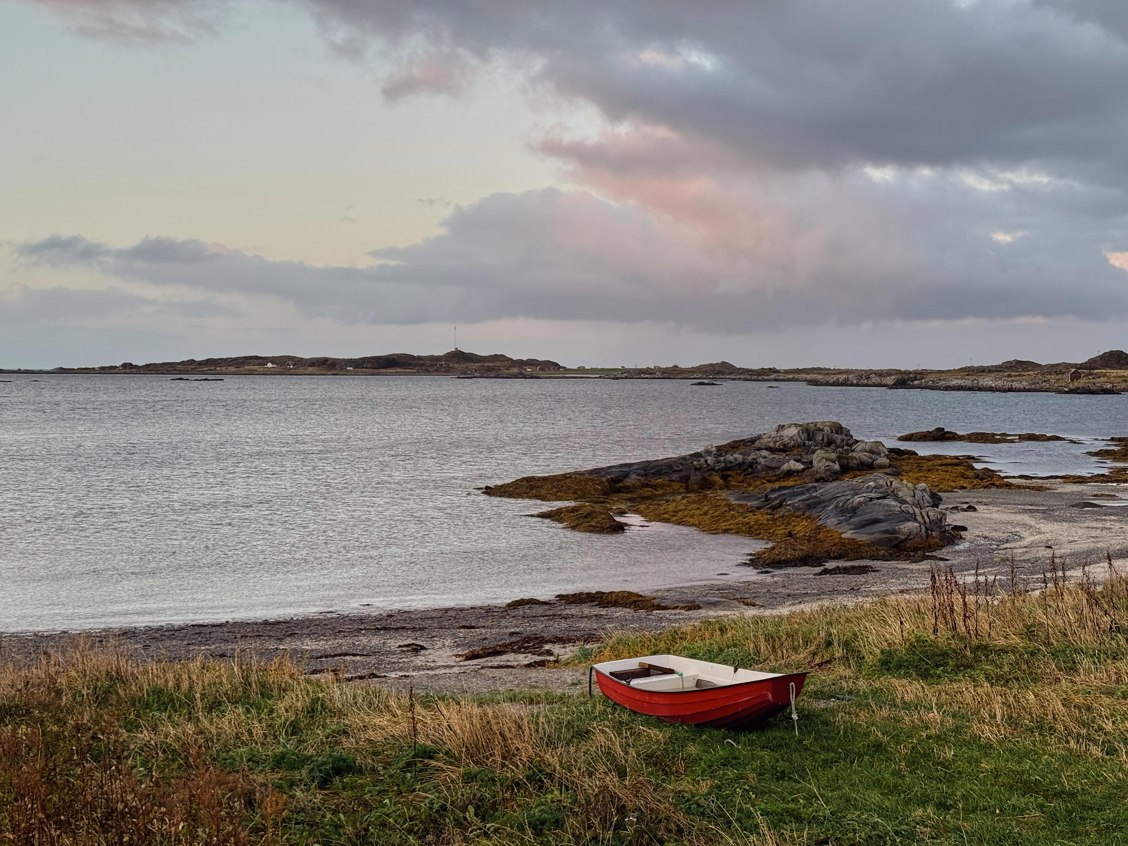 Red boat on the beach of Vestersand