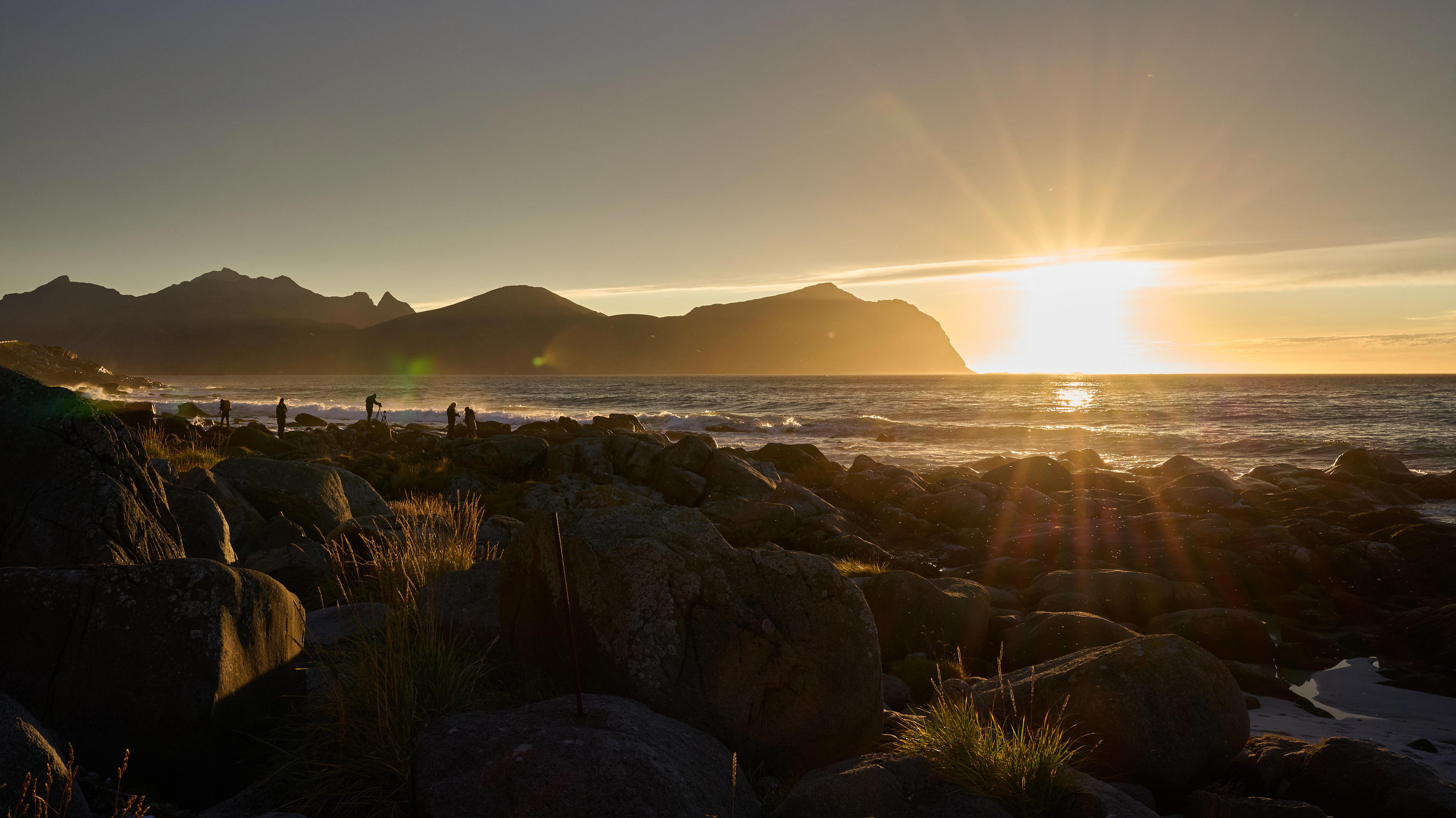 Image of Vikten beach at sunset with many photographers