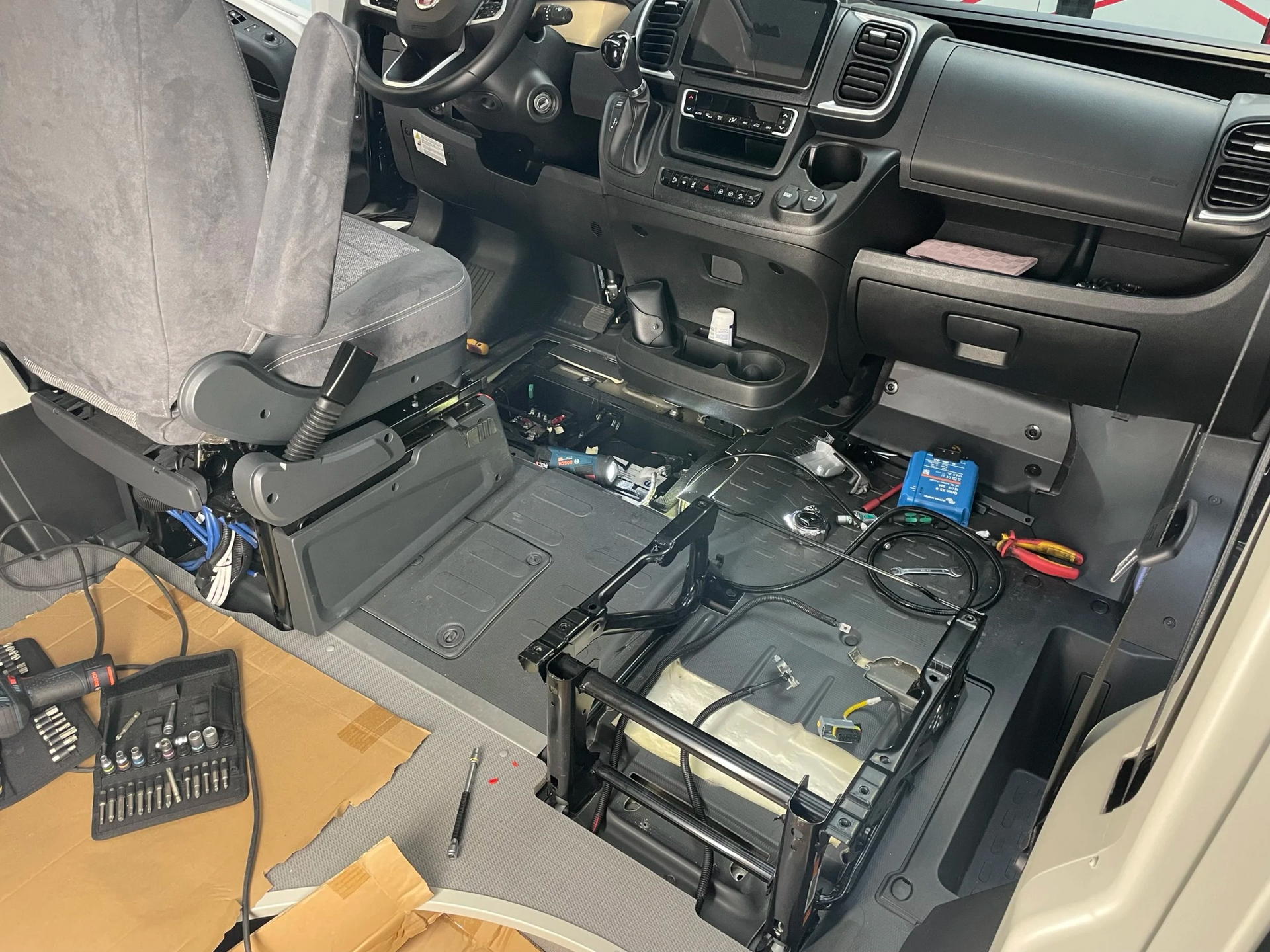 Image of car seat and removed battery