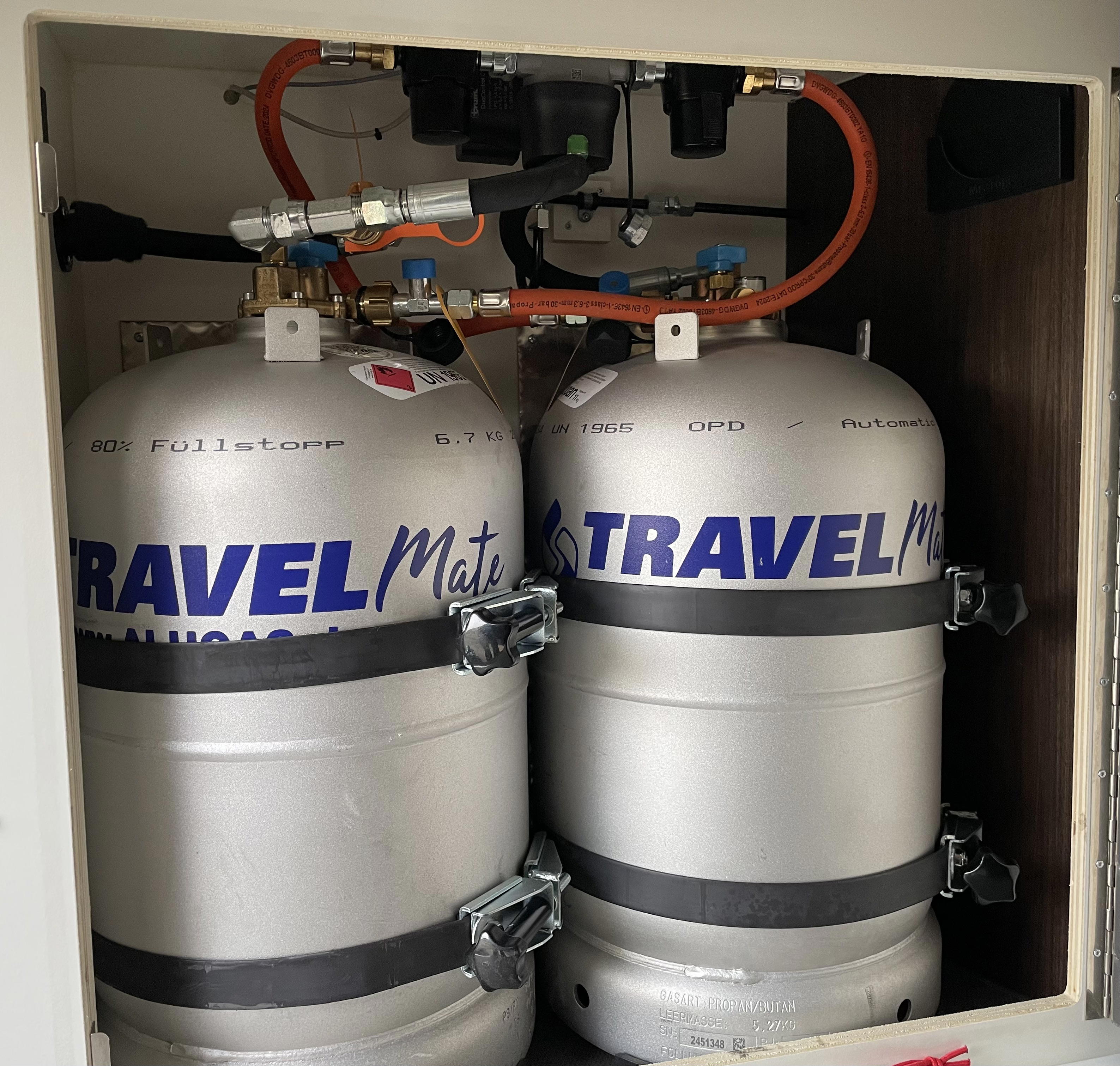 Installed gas tank bottles inside the gas compartment of the van
